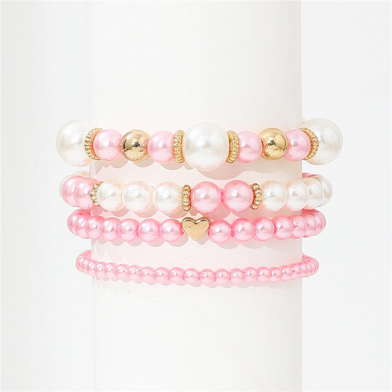 4-teiliges Set schlichter weißer Kunstperlen-Herzarmbänder, elegantes handgefertigtes Schmuckaccessoire