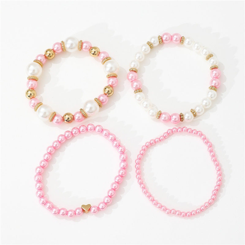 4-teiliges Set schlichter weißer Kunstperlen-Herzarmbänder, elegantes handgefertigtes Schmuckaccessoire