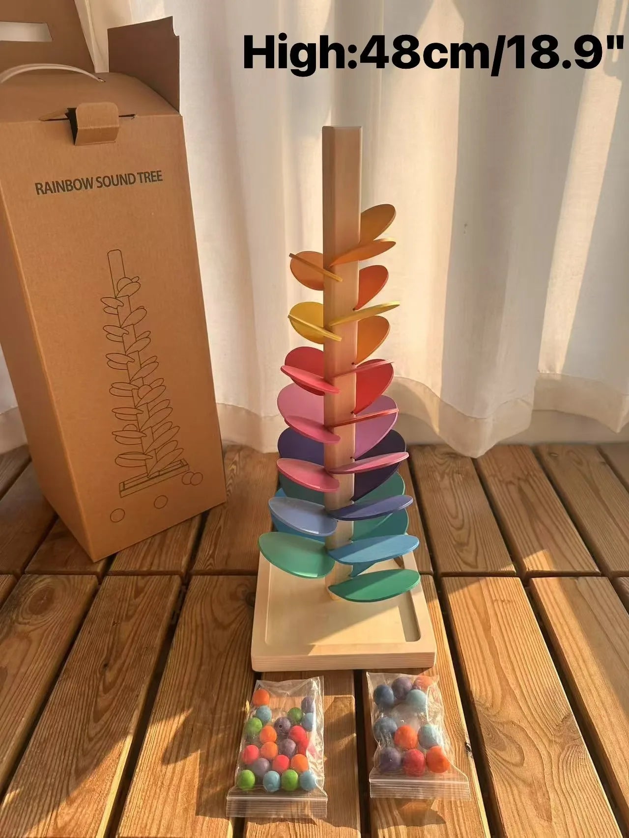 Hochwertige Regenbogen-Musik, klingende Bäume, Holzblütenblätter, Montage und Marmor-Lauf-Bälle, die Kinder-Lernspielzeug verfolgen